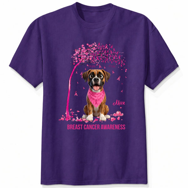 A purple short-sleeve crewneck t-shirt featuring a graphic of dogs wearing pink bandana under a pink tree with pink ribbons, with the text 'Breast Cancer Awareness' and customized with dog's names printed below.